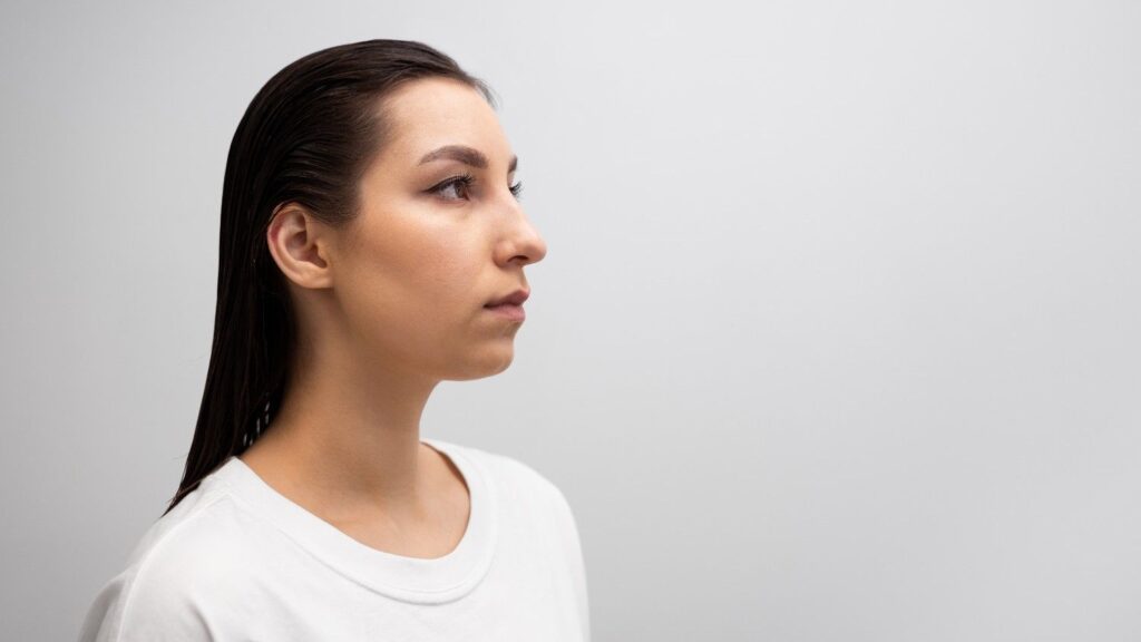 Woman with an upturned nose shape viewed from the front and side