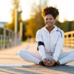 Person performing a butterfly stretch to improve hip flexibility and stretch the inner thigh muscles
