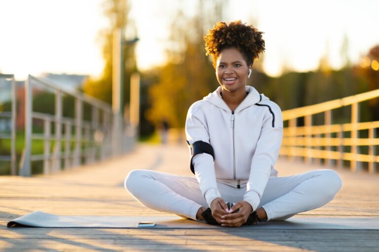 Person performing a butterfly stretch to improve hip flexibility and stretch the inner thigh muscles
