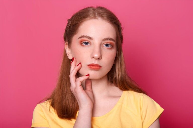 Woman with naturally rosy cheeks showing healthy facial skin and mild cheek redness.