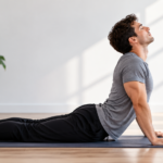 Man performing a spinal decompression exercise at home